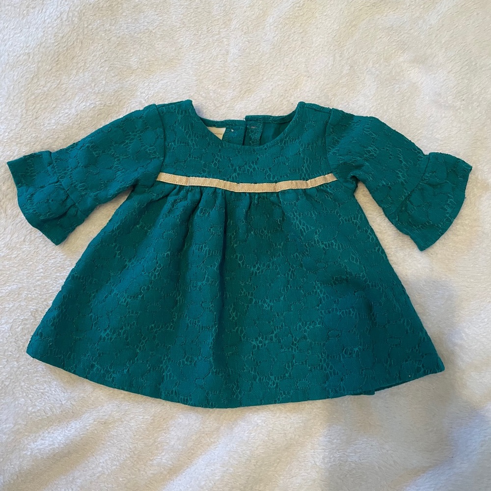 holiday green dress with gold ribbon